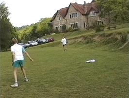 Ryan and Oliver play frisbee in the grounds of Beer youth hostel